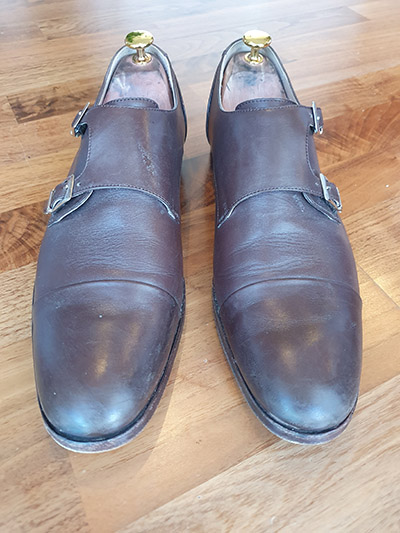 Pair of scuffed, brown Russell & Mr Hare double monk shoes